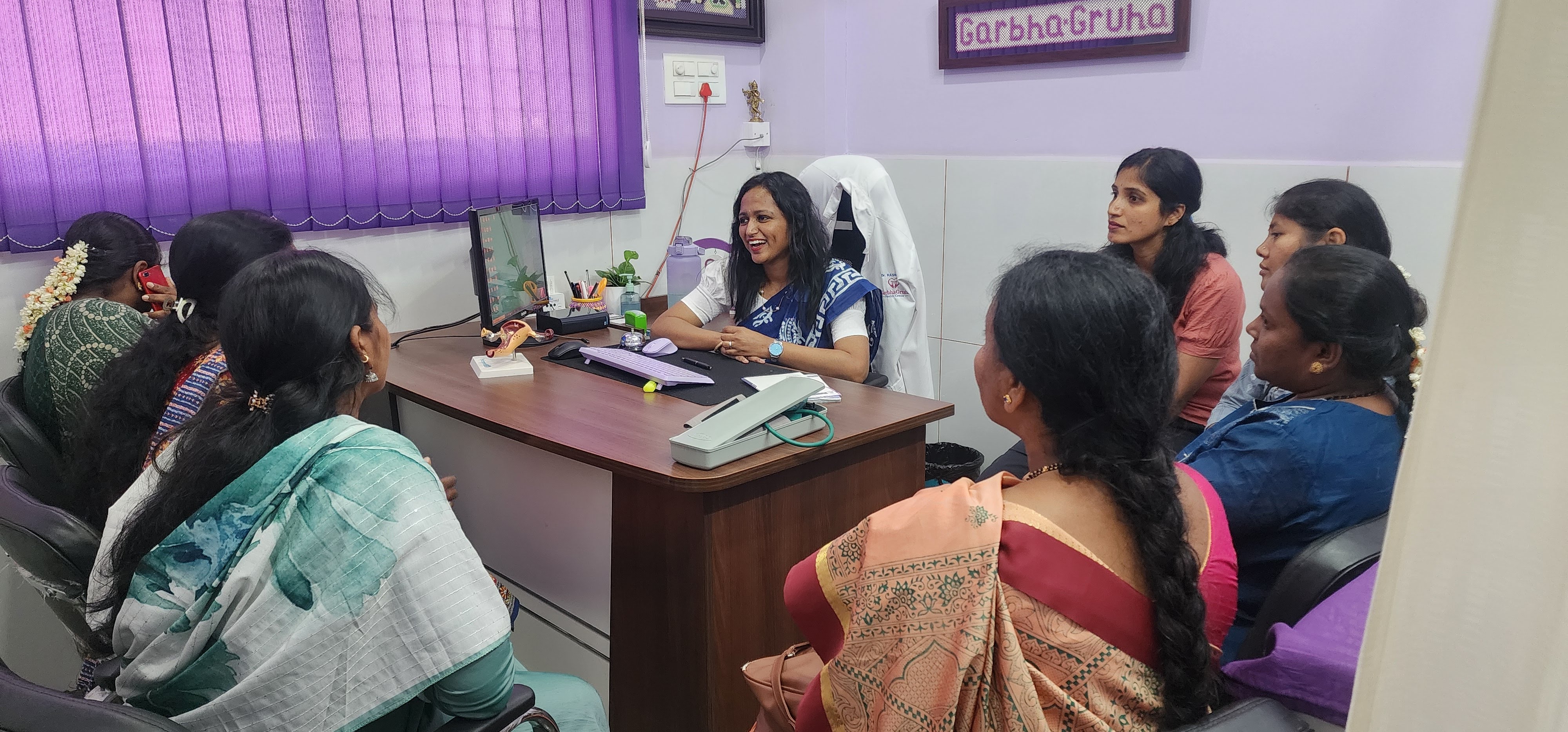 Dr. Rashmi T N conducting a women's health education session at GarbhaGruha Health Center, Bangalore
